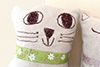 close up of handmade linen cat 1's face