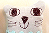 close up of handmade linen cat 3's face