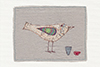 large framed textile picture of a bird made from stitched map with two cups