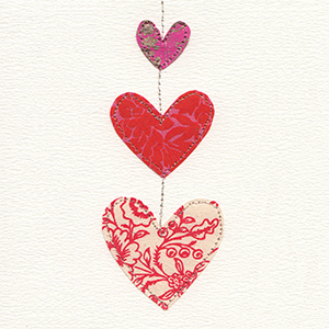 three hanging red fabric hearts handmade card