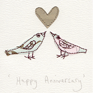 two facing stitched birds with gold heart between handmade card