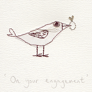 white bird with engagement ring in beak handmade card