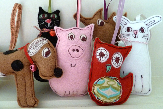 a collection of handmade animal decorations